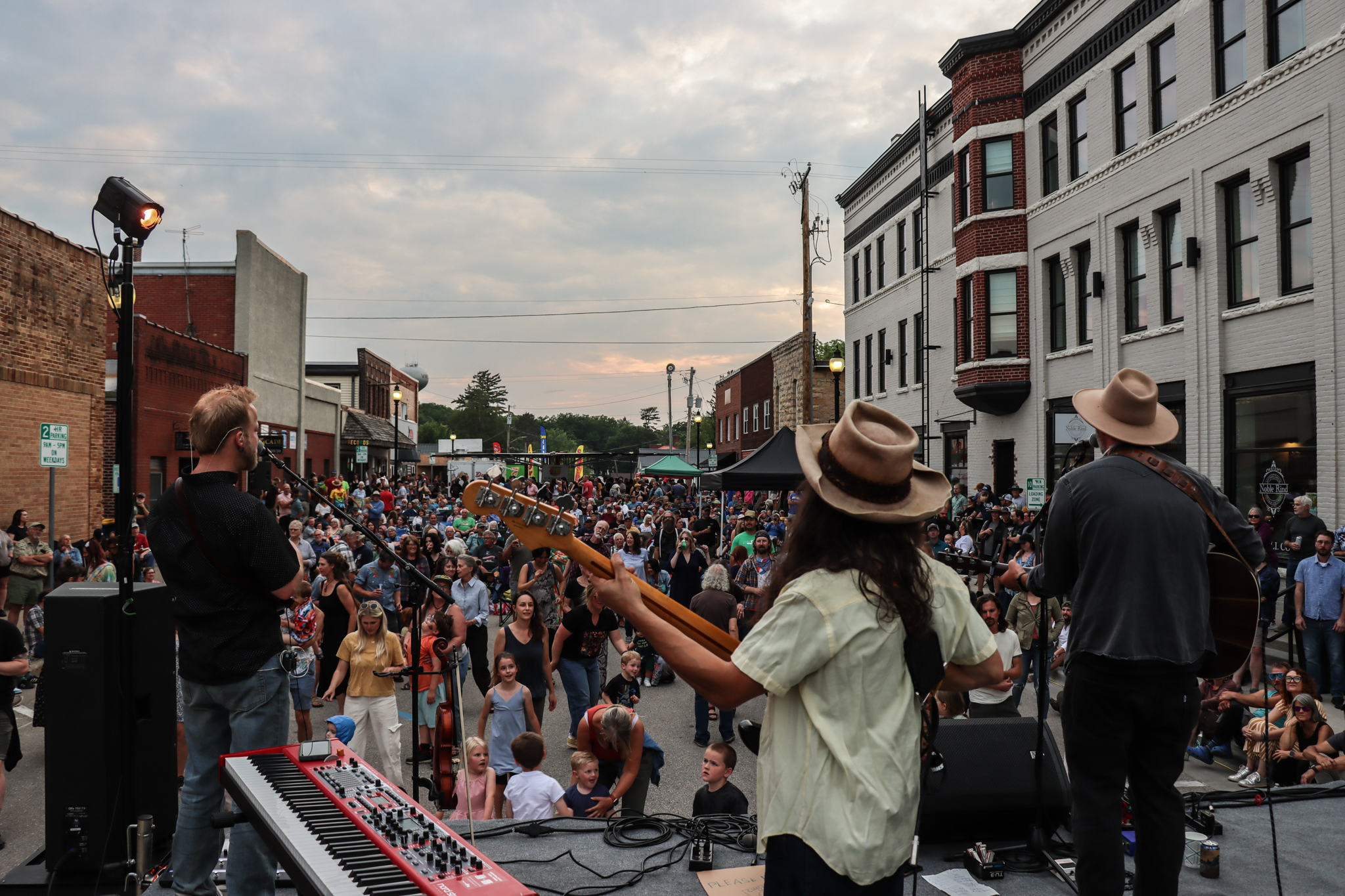 a band plays before a live crowd on a main street