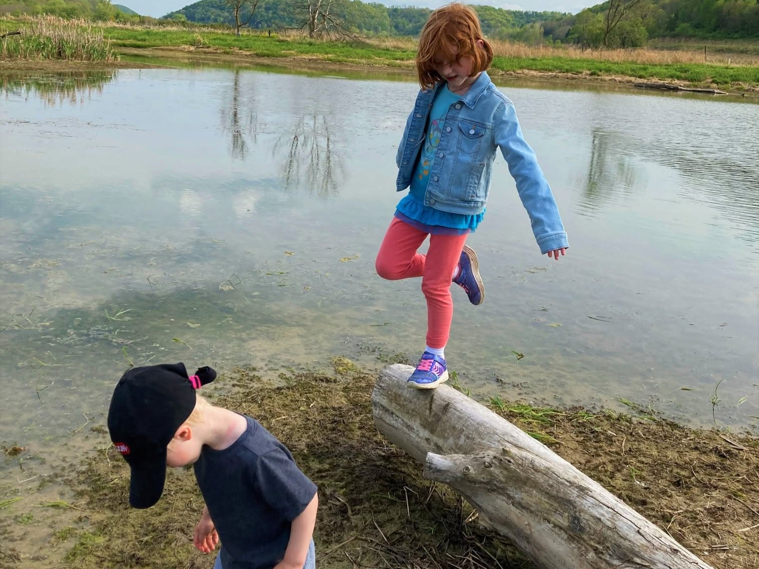 Kids playing at the creek edge