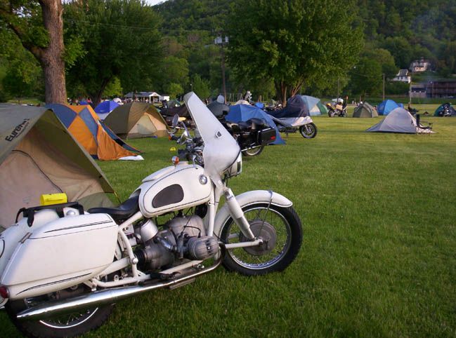 a motorcycle next to pitched tents at the beauford t anderson park