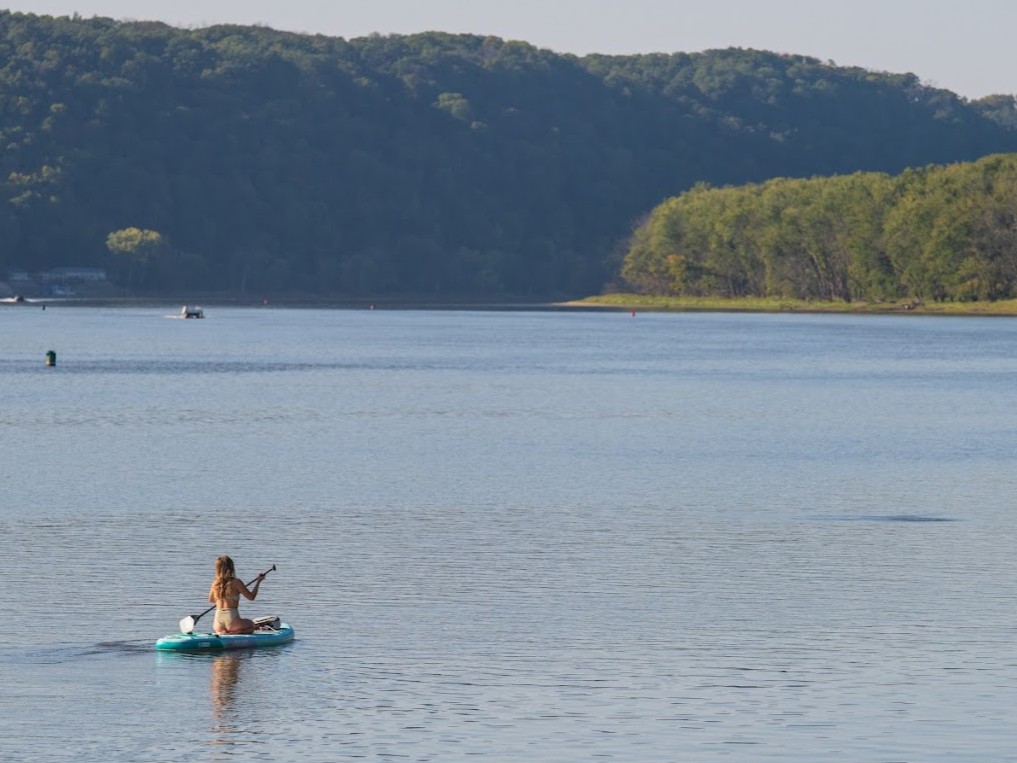 A woman paddles on the mississippi